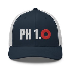 May include: A navy blue and white trucker hat with a white embroidered logo that says "PH 1.0" with a red circle.