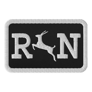 May include: A black and white embroidered patch with the letters "RN" and a stylized image of an antelope jumping between the letters.
