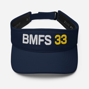 May include: A navy blue visor with white text that reads "BMFS 33" in yellow.