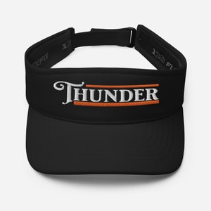 May include: Black visor with an orange and white embroidered "THUNDER" logo.