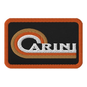 May include: An orange framed patch with a black background and a white retro-style logo that says "CARINI" with a brown and orange wave design.