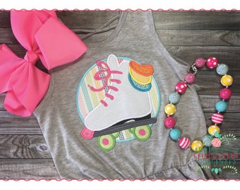 May include: A gray tank top with a white roller skate embroidered on it. The roller skate is surrounded by a circle with a rainbow stripe pattern. The tank top is paired with a colorful beaded necklace.