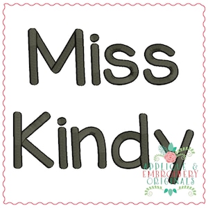 May include: Black and white embroidery design for a teacher's name tag. The design says "Miss KIndy" with a small floral design at the bottom.