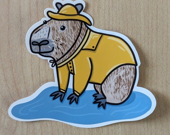 Cute Capybara Rainy Day Waterproof Sticker - Adorable Illustration of Capybara in Yellow Raincoat and Hat, Splashing in Blue Puddle