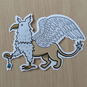 Enchanting Griffin Sticker – Fantasy-Inspired Cartoon Character Smiling with Cat Toy Mouse
