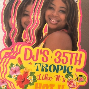 May include: A custom die-cut party sign featuring a photograph of a smiling person wearing an IT'S MY BIRTHDAY headband. The yellow sign displays the text DJ'S 35TH TROPIC LIKE IT'S HOT!!, decorated with colorful hibiscus flowers and a tropical cocktail.