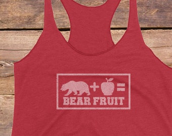 May include: Red tank top with a white graphic of a bear plus an apple equals bear fruit.