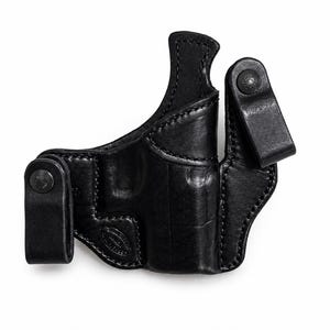 May include: A black leather holster with a molded design. The holster features a belt loop and a snap closure. The leather has a smooth, polished finish. The holster is designed to be worn on the body.