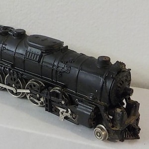 May include: A rustic wooden sign with the text "Welcome to our home" in a handwritten style. The sign features a distressed finish and a simple, inviting design, perfect for entryway decor.