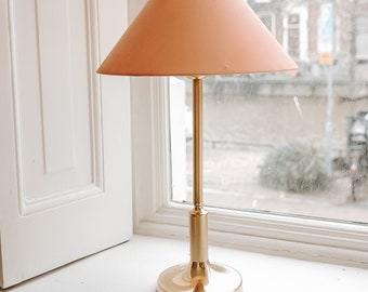 Brass lamp with salmon pink shade