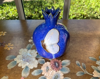 Pomegranate Art. Ceramic Pomegranate with a butterfly.