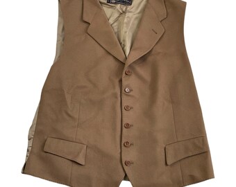 May include: A brown wool vest with a notched collar and six buttons. The vest has two pockets on the front and a satin lining.