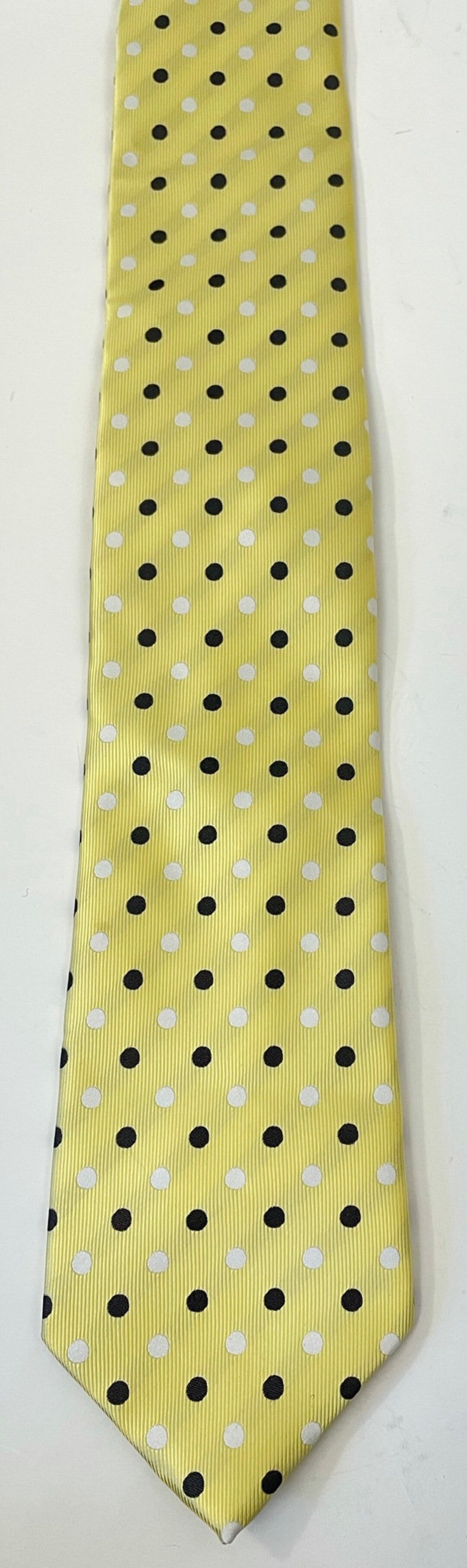 yellow and white polka dot tie