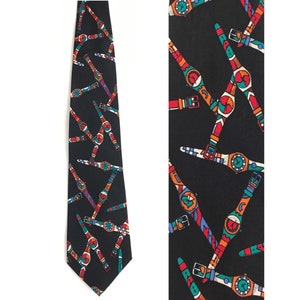 May include: A black silk tie with a repeating pattern of colorful wristwatches. The watches are in various shades of red, orange, blue, green, and white.