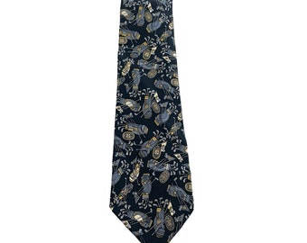 May include: A black silk tie with a repeating pattern of golf bags and clubs in shades of gold, white, and gray.