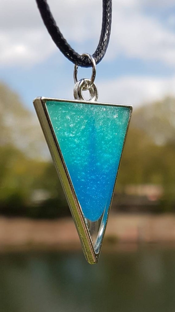 Necklace with triangular pendant made of epoxy resin metallic: turquoise blue like the Caribbean in a silver frame