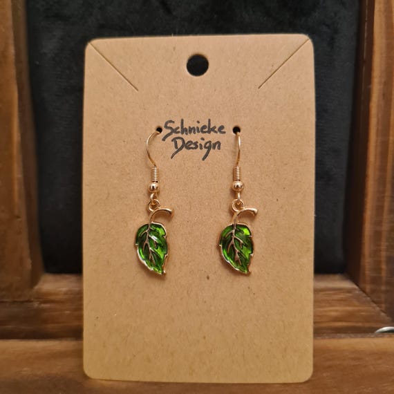 Earrings with small enamel leaves