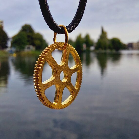 Black chain with golden gear