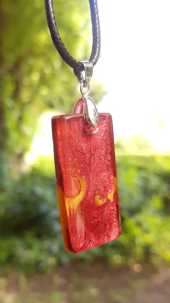 Necklace with rectangular pendant made of epoxy resin - red meets gold (metallic colors)