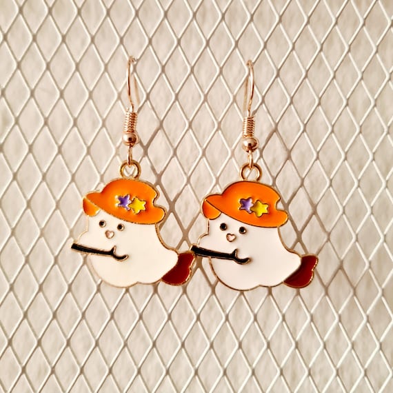 Earrings with cute ghosts on witches' brooms