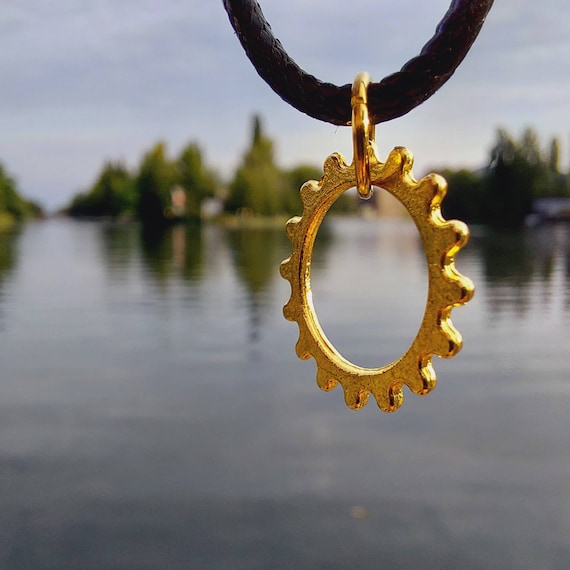 Black chain with golden gear