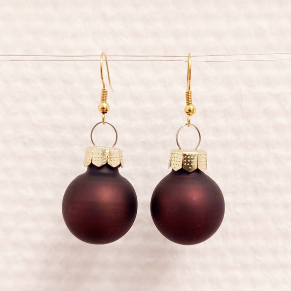 Christmas earrings with orange and brown balls