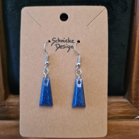 Earrings / eardrops made of epoxy resin cast in silver and metallic midnight blue with a slight glitter effect