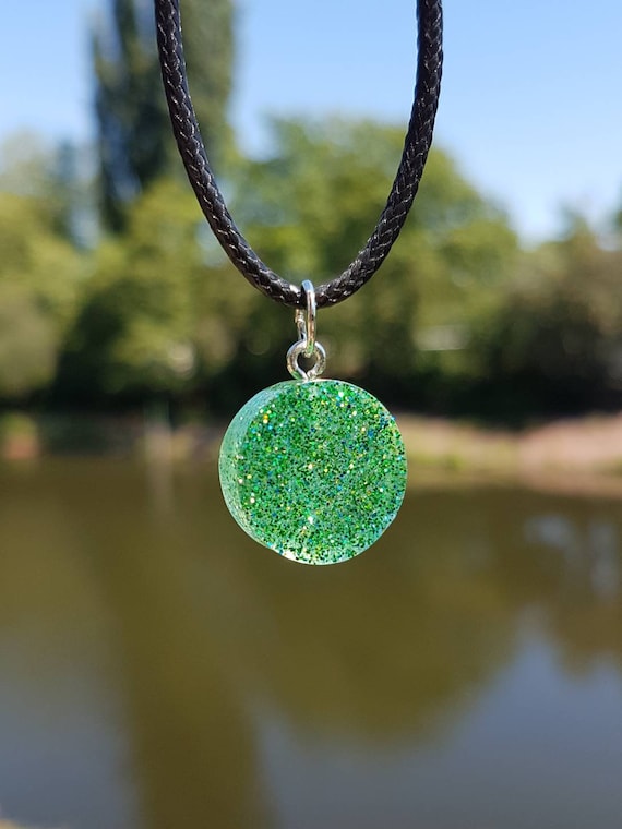 Necklace with handmade round pendant made of epoxy resin - blue, green and silver glitter in transparent epoxy