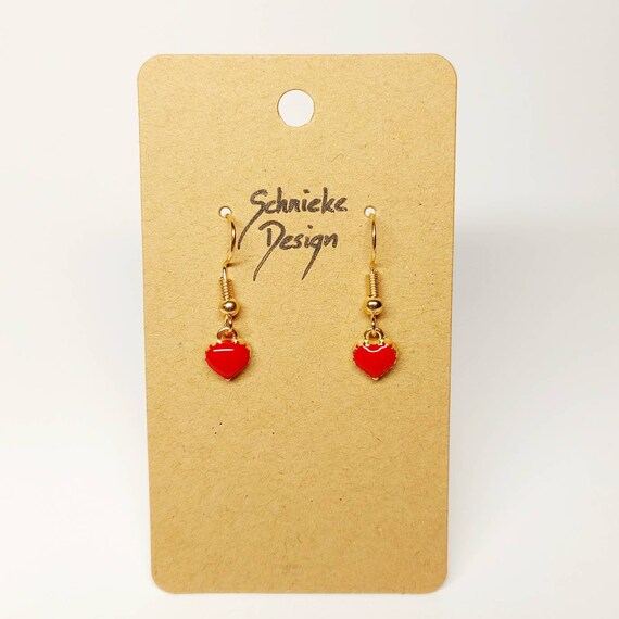 Golden earrings with small colorful hearts