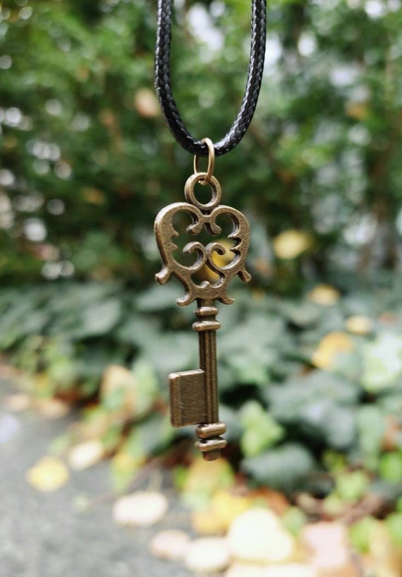 Black necklace with bronze steampunk key