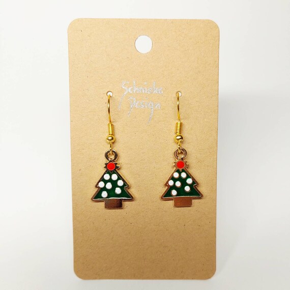 Earrings covered with snow fir tree