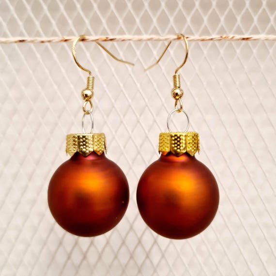 Christmas earrings with terracotta-colored balls