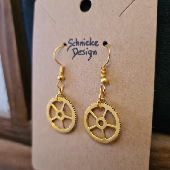 Earrings with small gears in gold