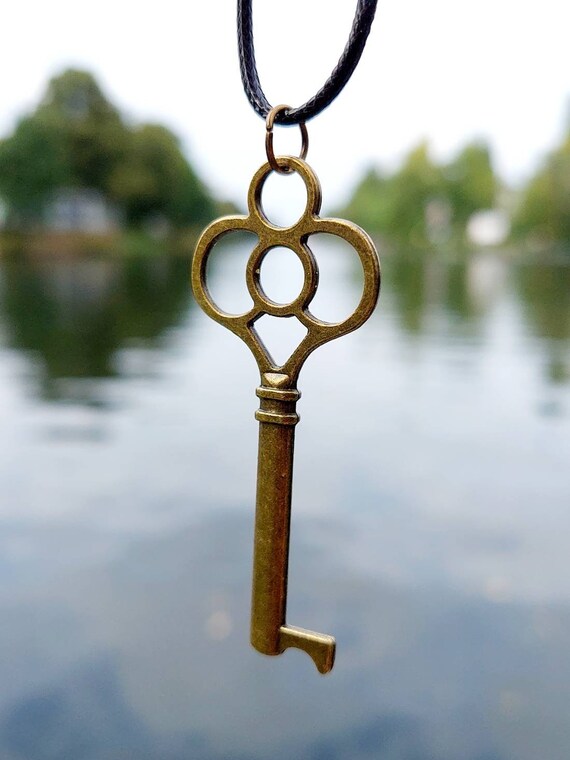 Black chain with bronze steampunk key