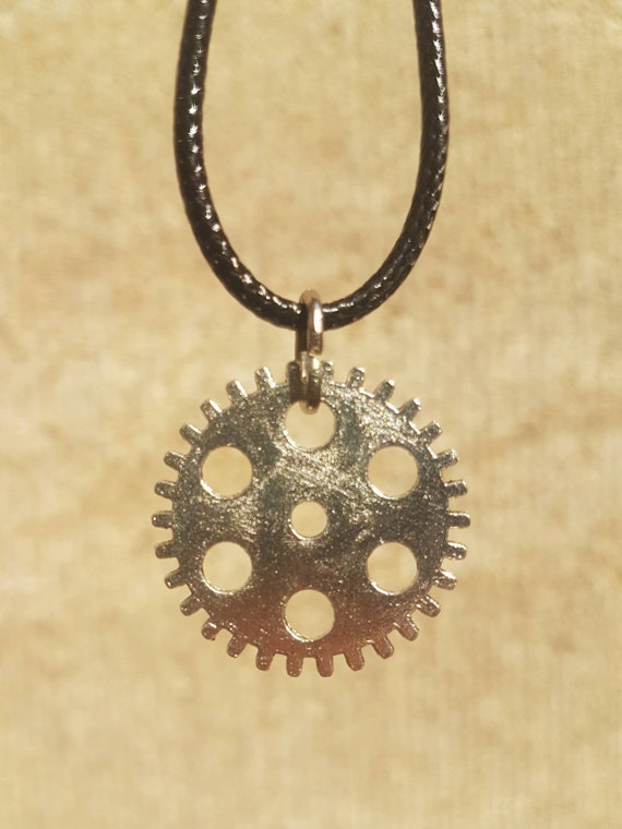Black necklace with silver pendant - gear with 7 small punched circles
