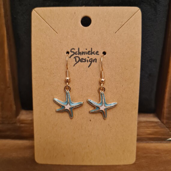 Earrings with light blue enamel starfish