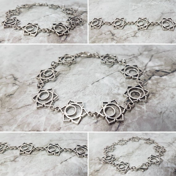 Silbernes Armband mit Blüten, Sonnen, Augen - je nach Assoziation ;)