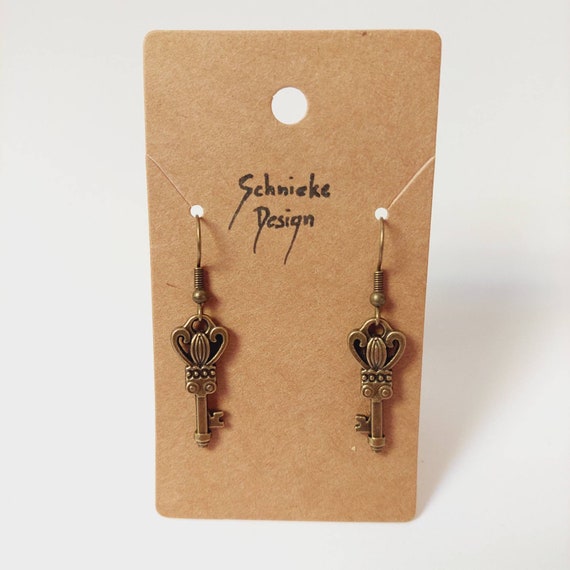 Earrings with small keys in bronze