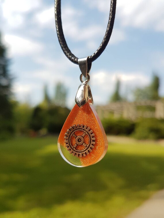 Necklace with drop-shaped pendant - bronze gear cast in metallic bronze and transparent epoxy resin