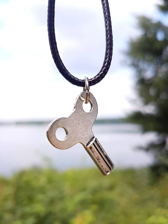 Black necklace with silver pendant - vintage wing key