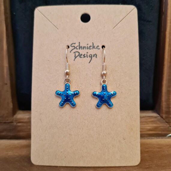 Earrings with starfish made of enamel