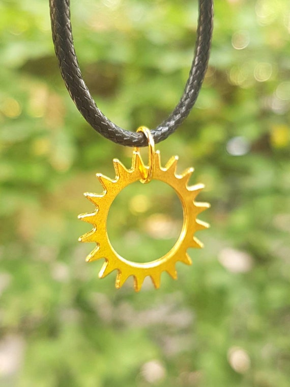 Black necklace with gold-colored pendant - Steampunk gear