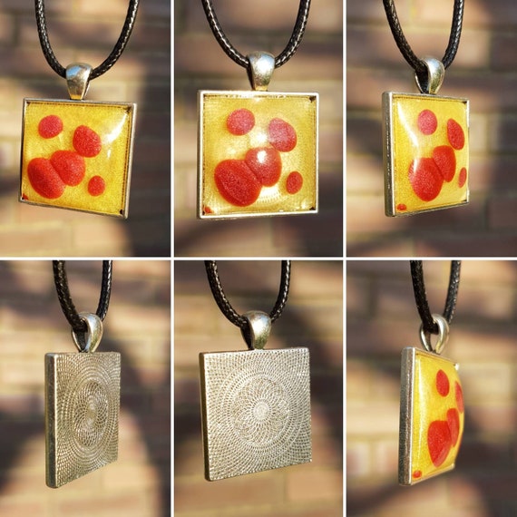 Necklace with pendant - silver square amulet with cheeky red dots on a yellow background (metallic)