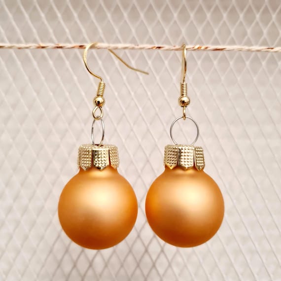 Christmas earrings with apricot-colored balls
