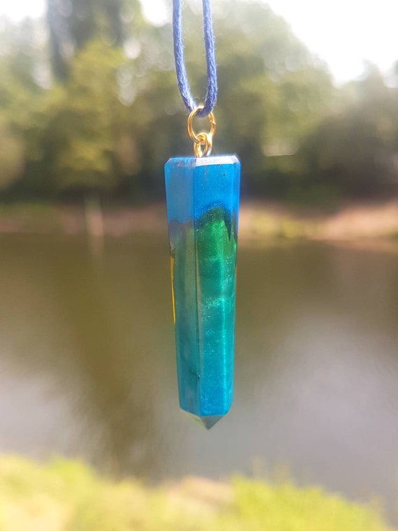 Necklace with pendant made of epoxy resin - metallic blue meets transparent orange - stalactite shape