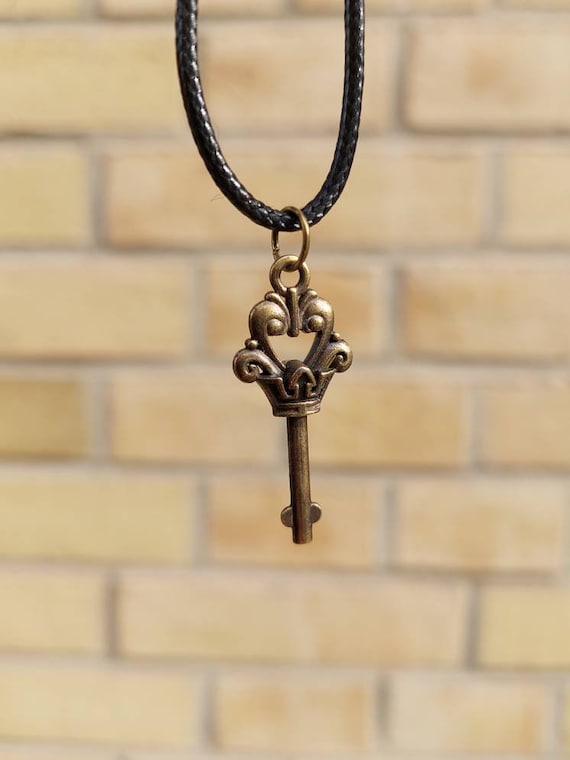 Black chain with bronze steampunk key