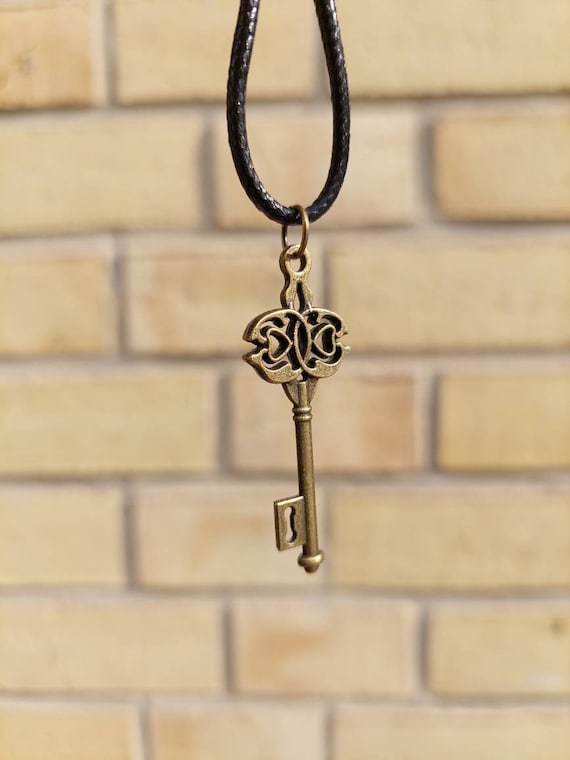 Black chain with bronze steampunk key