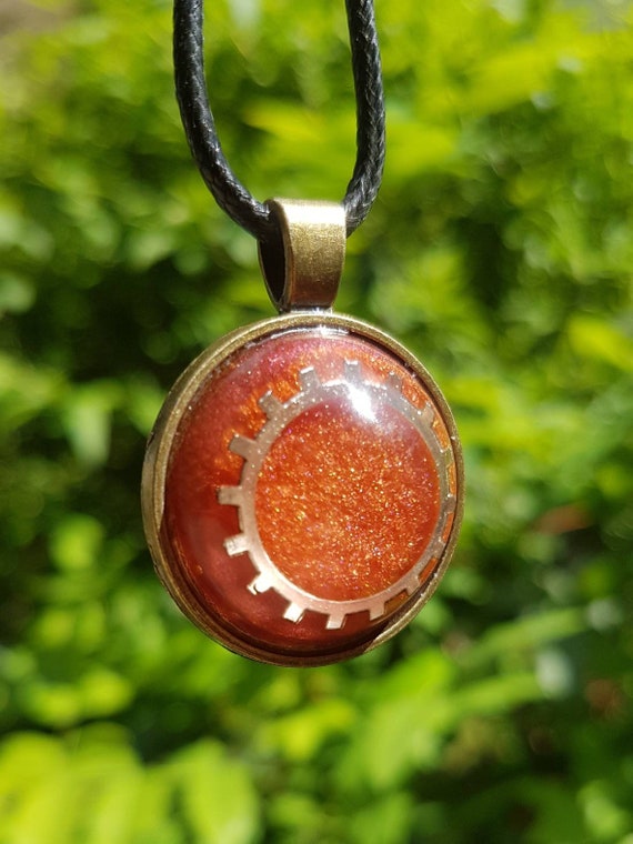 Necklace with round pendant: Amulet with silver gear cast in metallic bronze epoxy resin - setting in antique bronze