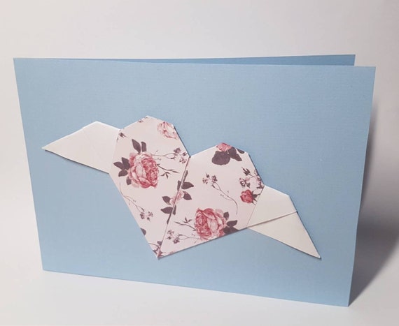 Light blue folding card with roses origami heart with white wings