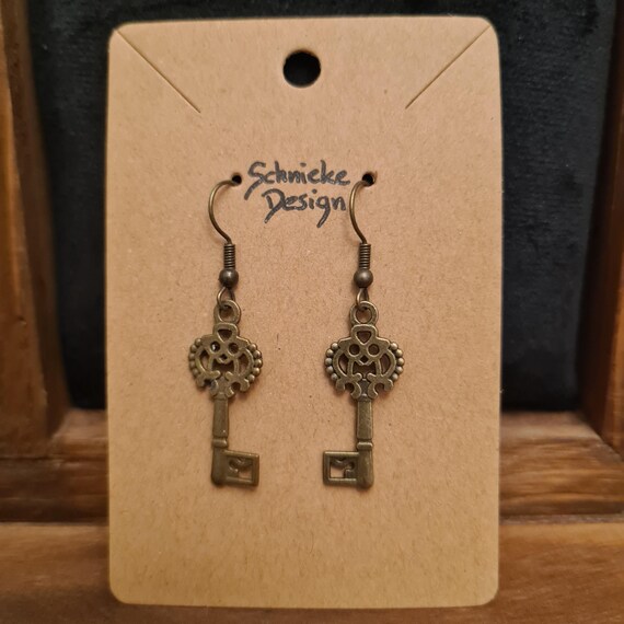 Earrings with keys in antique bronze